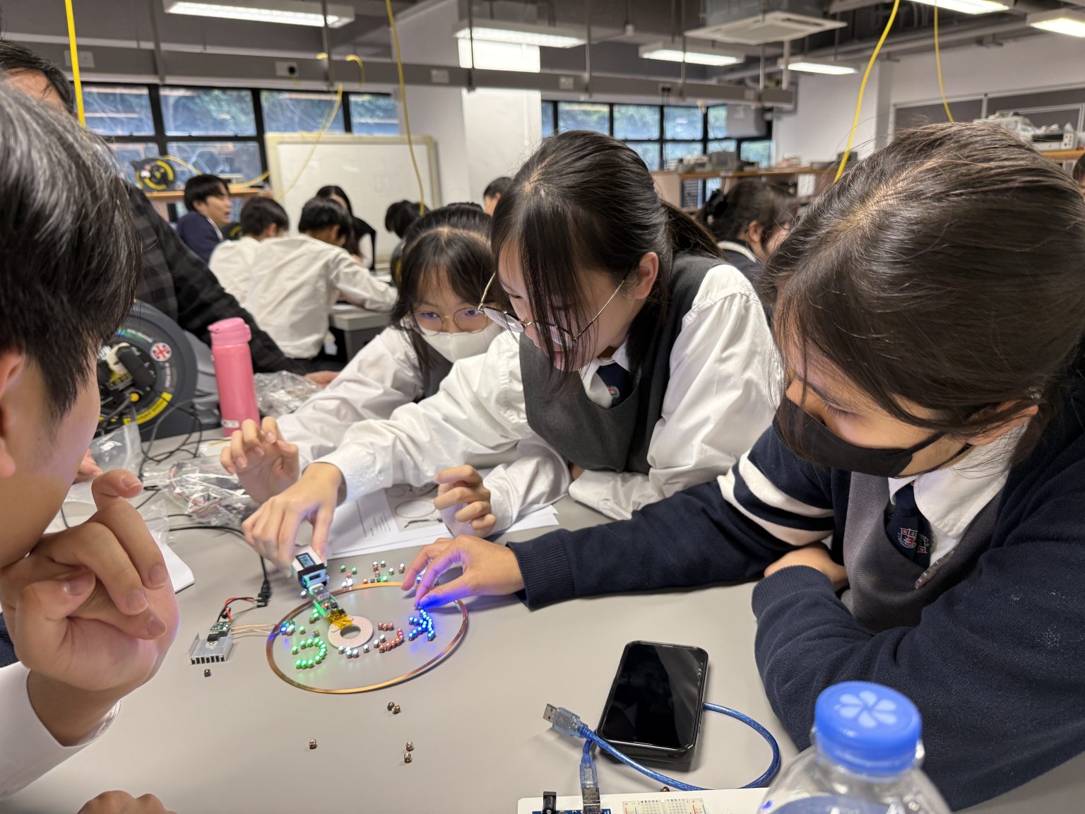 Student groups explore the wireless charging activity.