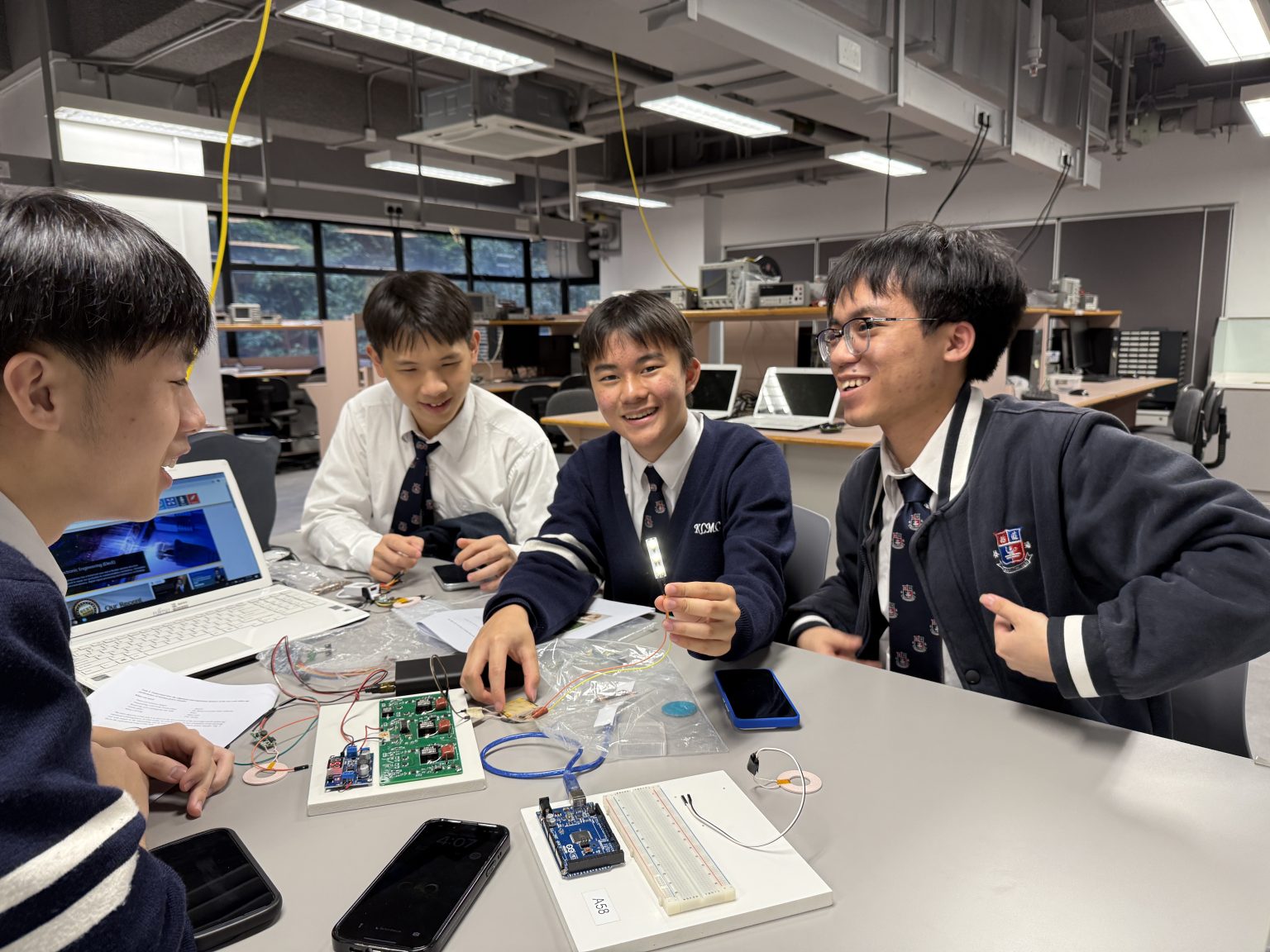 Student groups explore the wireless charging activity.