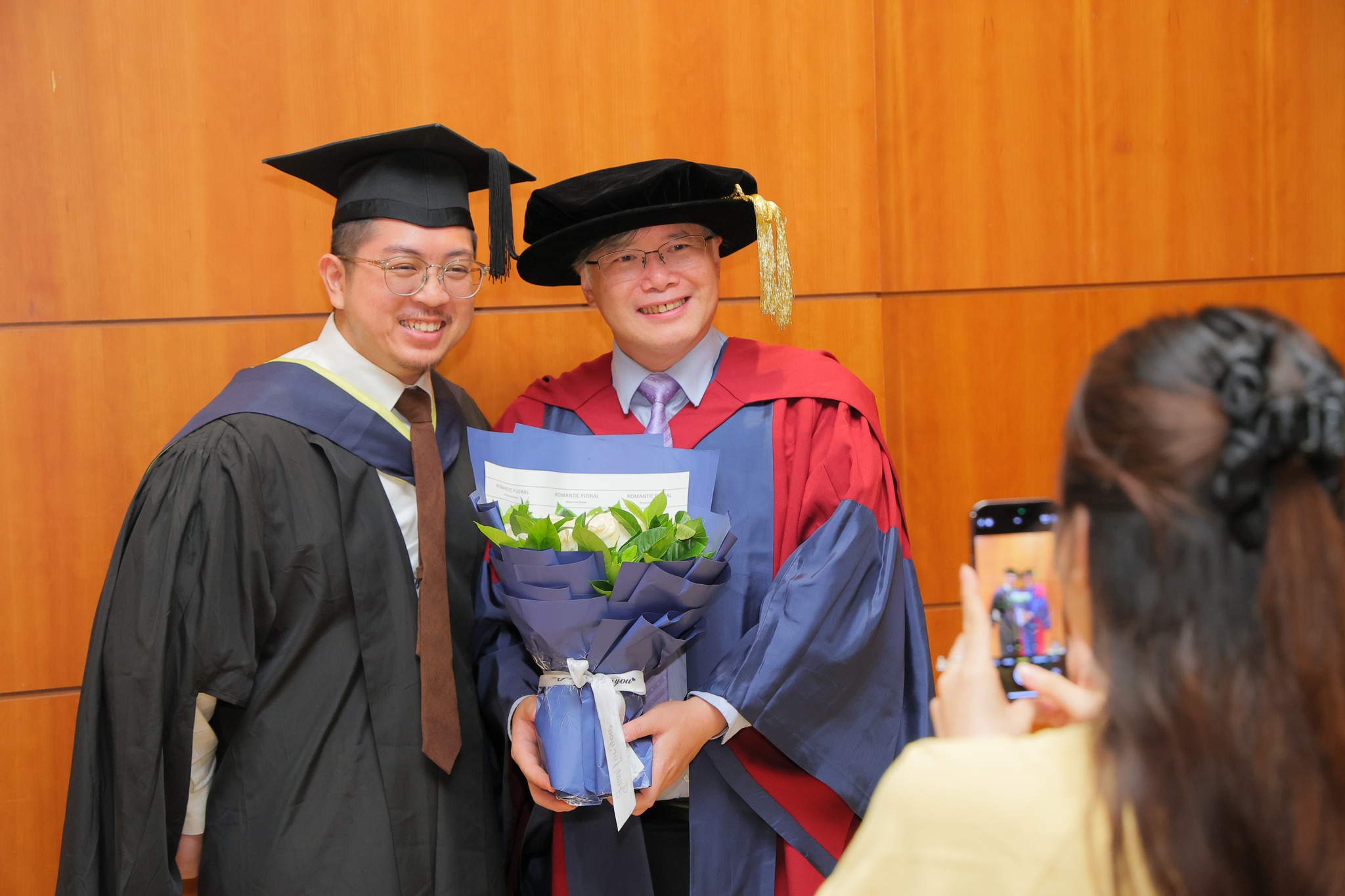 Group photo of teacher and student