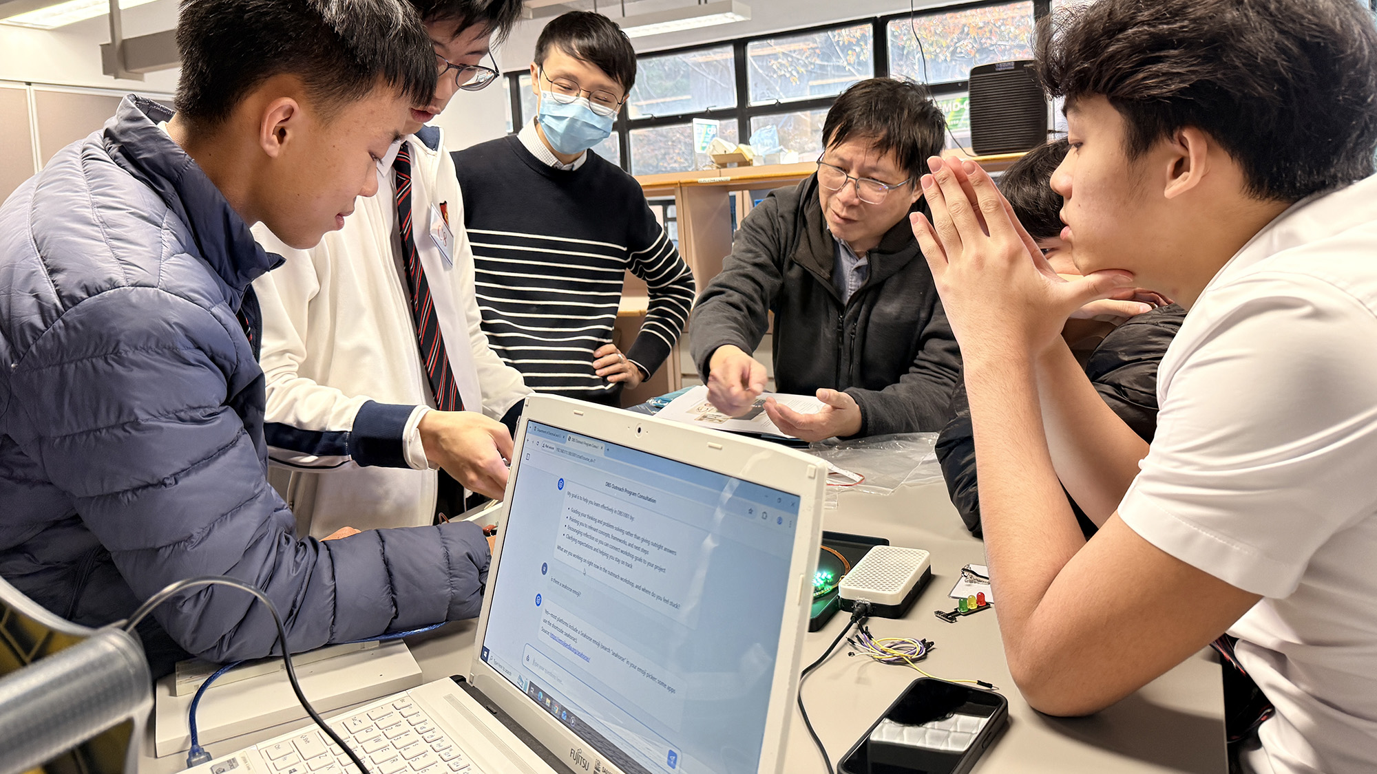 Students also had the opportunity to interact with our in-house, knowledge-based chatbot (K-bot), specifically developed for the workshop, which provided real-time guidance and assisted them in overcoming challenges throughout the activities.